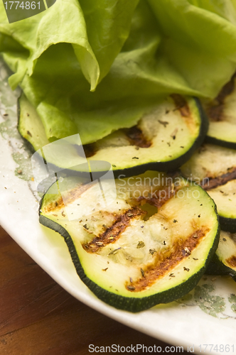 Image of Grilled organic zucchini slices with herbs and spices