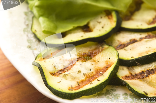 Image of Grilled organic zucchini slices with herbs and spices