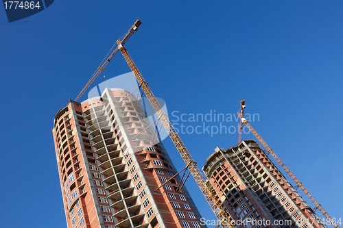 Image of Construction of two parallel skyscrapers