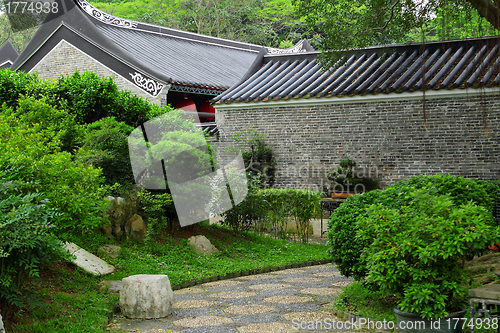 Image of chinese building in green forest