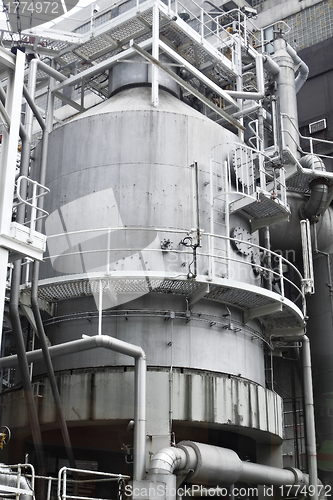 Image of Pipes, tubes, machinery and steam turbine at a power plant 