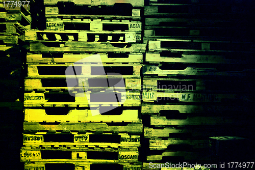 Image of pile of pallets at night
