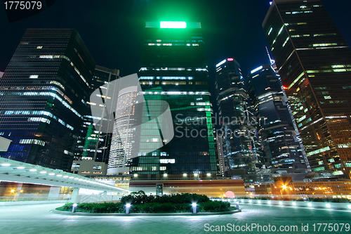 Image of modern office building in downtown city at night