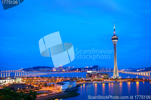 Image of Cityscape in night with famous travel tower near river in Macao,