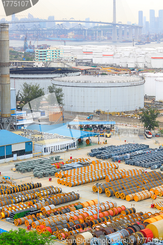 Image of power station , gas tank and cable roll