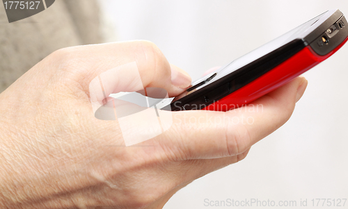 Image of Mobile phone With hand 