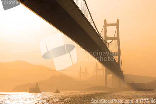 Image of bridge in sunset , under view