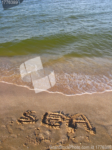 Image of inscription on the sand of the sea