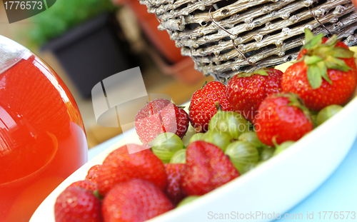 Image of Strawberries, gooseberry, basket and compote