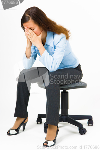 Image of Stress. Woman hides her face