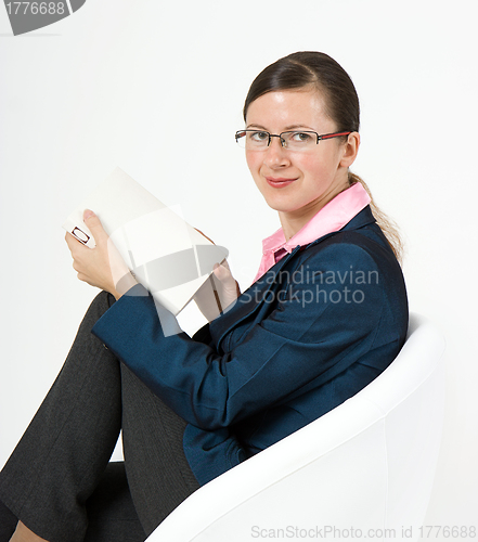 Image of girl in glasses with a book