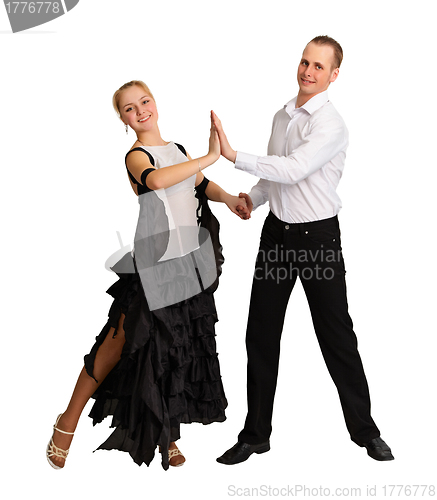 Image of Young couple performs ballroom dance