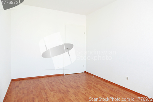 Image of Empty room with white door