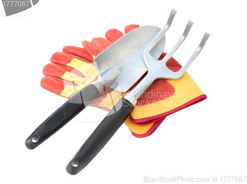 Image of Gloves and  tool on a white