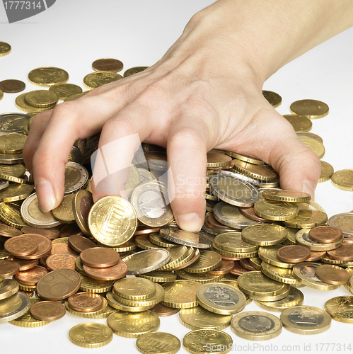 Image of hand while gathering euro coins