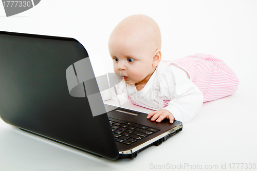 Image of little kid with a laptop