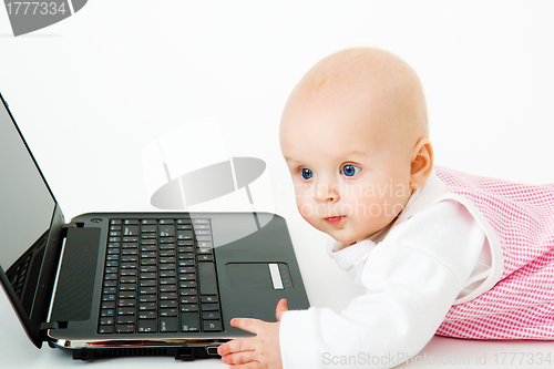 Image of kid with a laptop