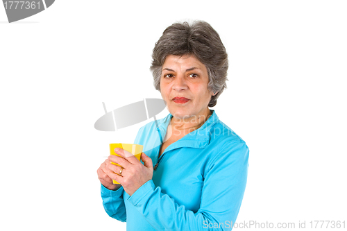 Image of Senior woman drinking coffee or tea 