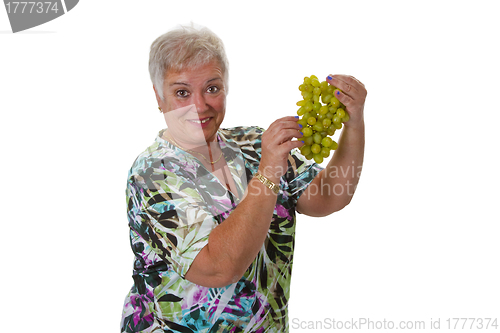 Image of Female senior with grapes 