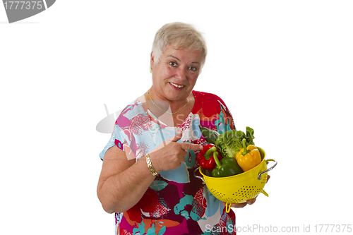 Image of Female senior with fresh vegetables