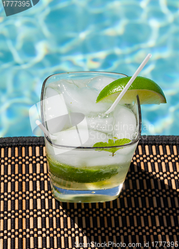 Image of Cocktail Majito on edge by poolside