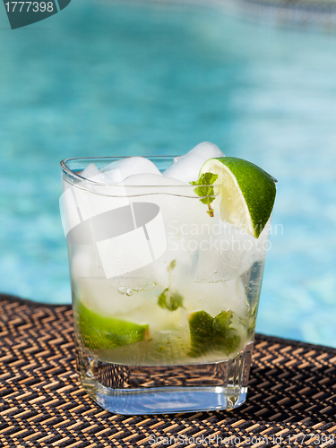 Image of Cocktail Majito on edge by poolside