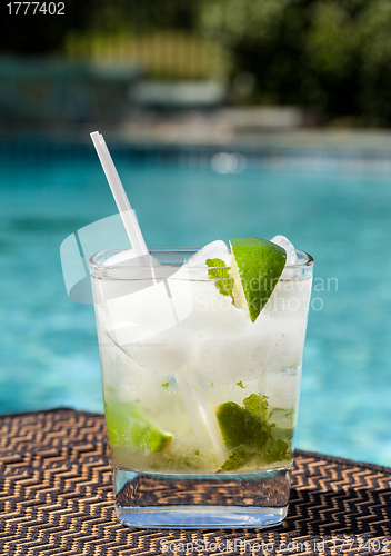 Image of Cocktail Majito on edge by poolside