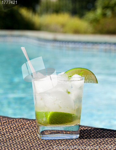 Image of Cocktail Majito on edge by poolside