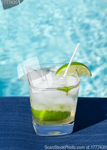 Image of Cocktail Majito on edge by poolside