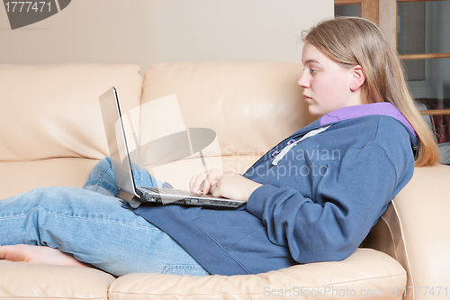 Image of teenage girl using laptop