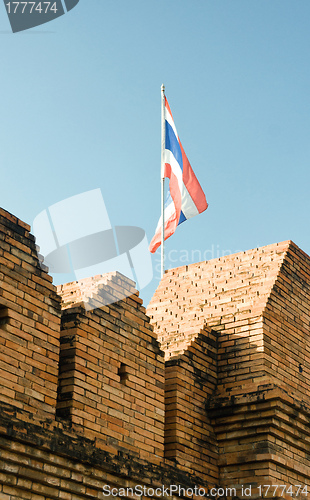 Image of flag of thailand over wall