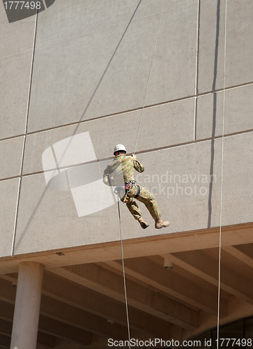 Image of abseiling down the wall