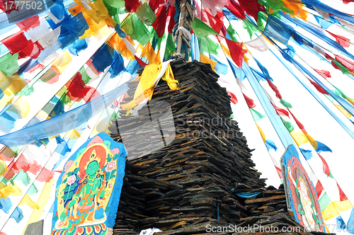 Image of Tibetan prayer flags and mani rocks