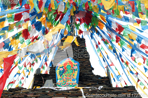 Image of Tibetan prayer flags and mani rocks