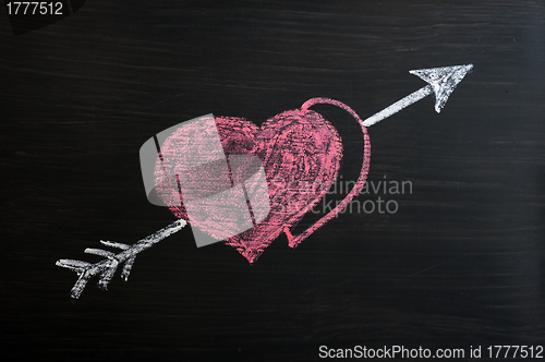 Image of Love hearts with Cupid arrow on a chalkboard 