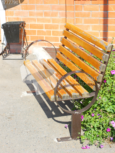 Image of Wooden park bench in the garden