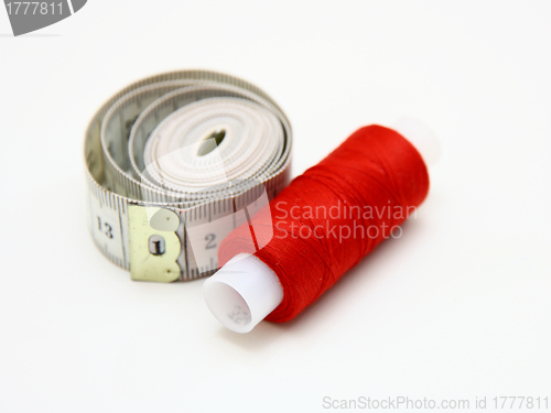 Image of The coil of a red thread with centimeter 