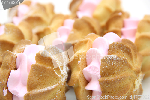 Image of Yellow cookies with a  stuffing  on a white background 