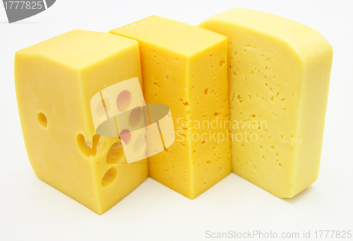 Image of three pieces of different kinds of cheese