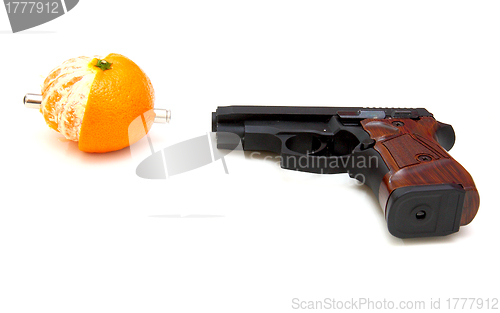 Image of The close up of a pistol a tangerine