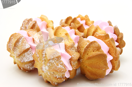 Image of Yellow cookies with a  stuffing  on a white background 