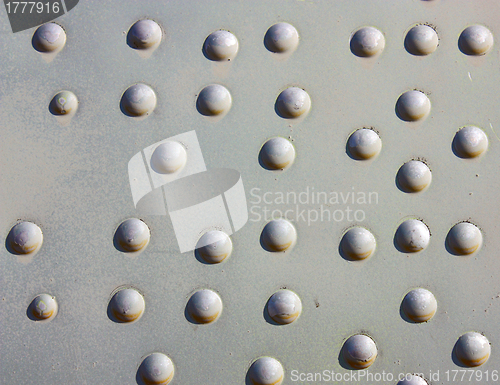 Image of A silver painted metal aircraft background  with  rivets.