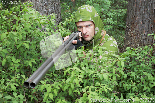 Image of Angry hunter with an old gun