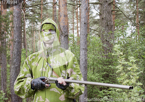 Image of The shooter in camouflage