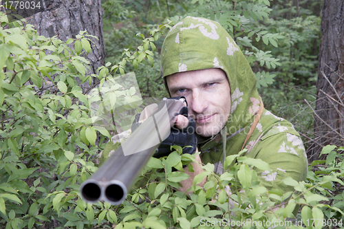 Image of The shooter in camouflage