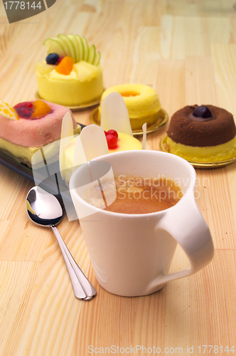 Image of espresso coffee and  fruit cake
