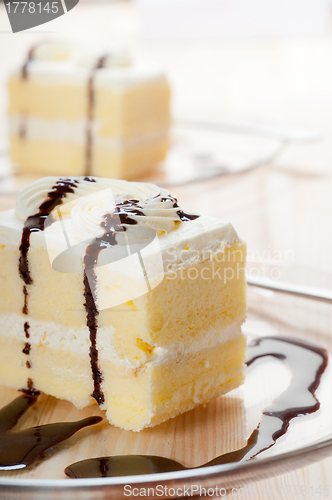 Image of fresh cream cake closeup with chocolate sauce