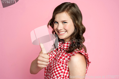 Image of Beautiful smiling girl with ok gesture