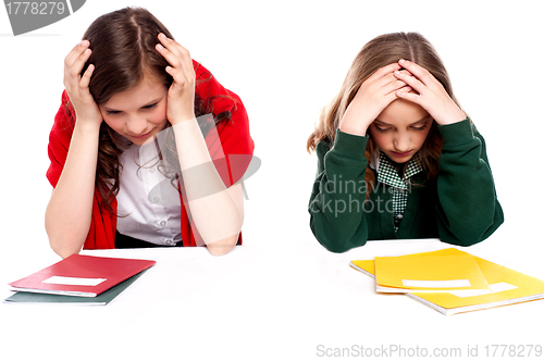 Image of Confused students holding their heads