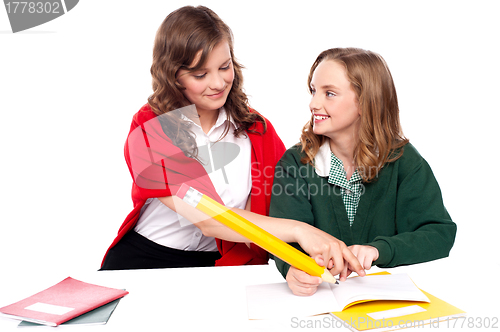 Image of Girl explaining solution to her friend